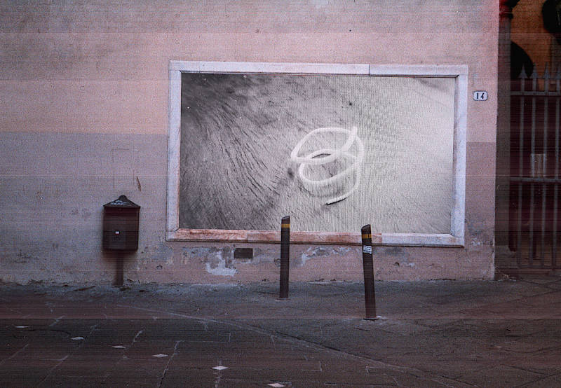 a plastic spiral on a wooden board is displayed on an old wall display frame