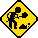 a stick figure shoveling on a yellow warning sign, also looks like the figure is digging a hole