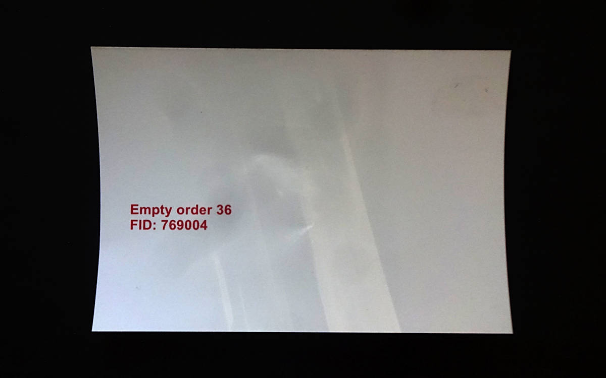 piece of photographic paper, white with red text, Empty order 36 FID: 769004