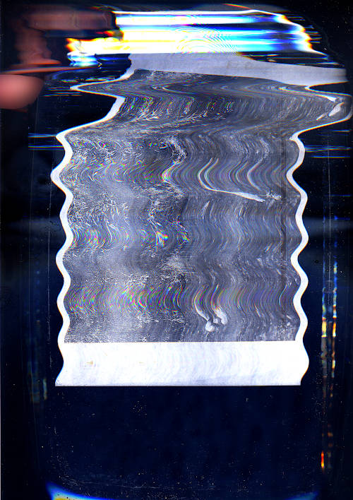 heron 2 scan image. very distorted glitch image, a hand is visible touching the water