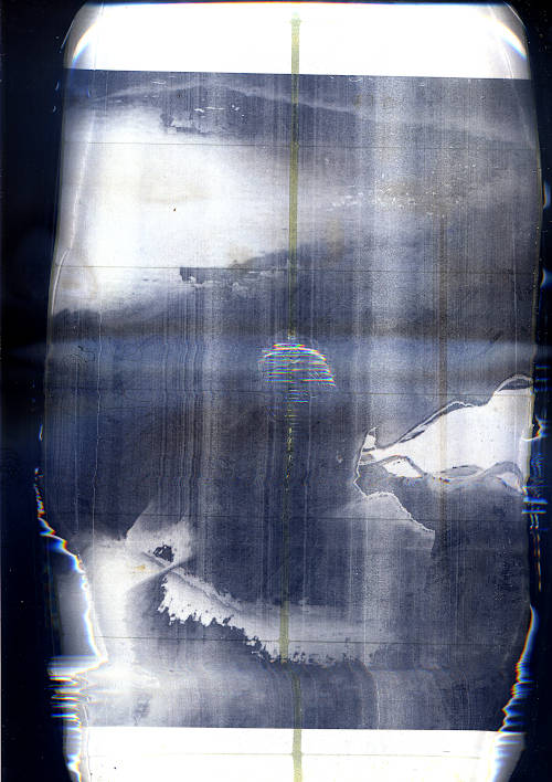 wave labels scan image. wavy video art still. printed as black and white laser label sheet. theres a big water drop in the middle of the page, the edges are distorted