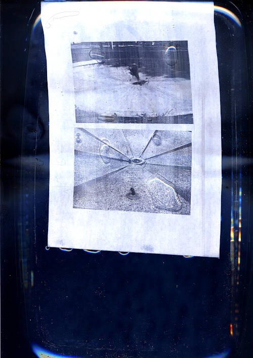 dry public fountains scan image. laser printed copy with two pictures of dry public fountains. water drops visible on the print