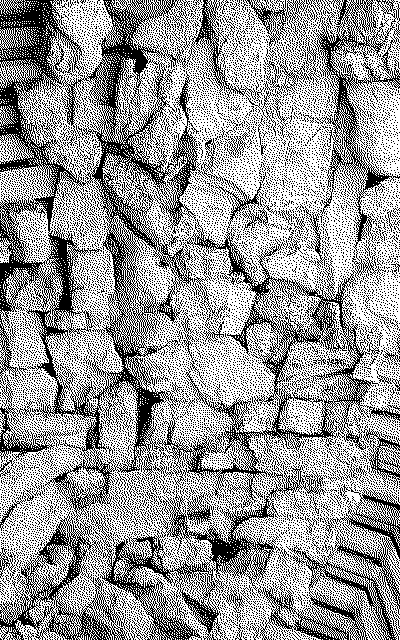 fake salt cave entrance portal of a historic salt factory. imitations of natural stone are carved out of stone, giving the impression of a cave entrance.