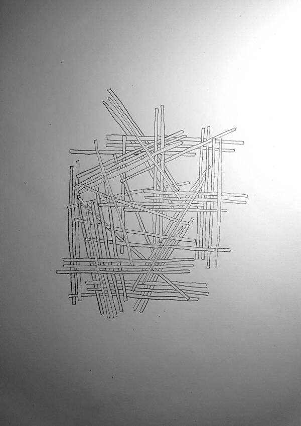 many thin pieces of wood lie on top of each other.
