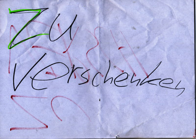 piece of paper with handwritten words “Zu Verschenken” (Give Away)