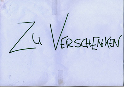 piece of paper with handwritten words “Zu Verschenken” (Give Away)