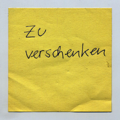 piece of paper with handwritten words “Zu Verschenken” (Give Away)