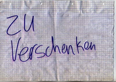 piece of paper with handwritten words “Zu Verschenken” (Give Away)